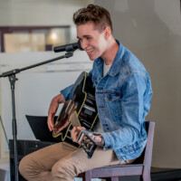 music teacher playing guitar