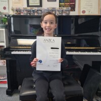 male student holding ANZCA exam result