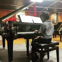 boy playing piano