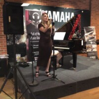 kid playing piano and lady singing