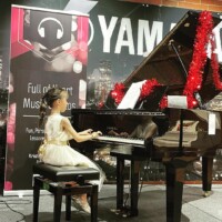 girl playing piano